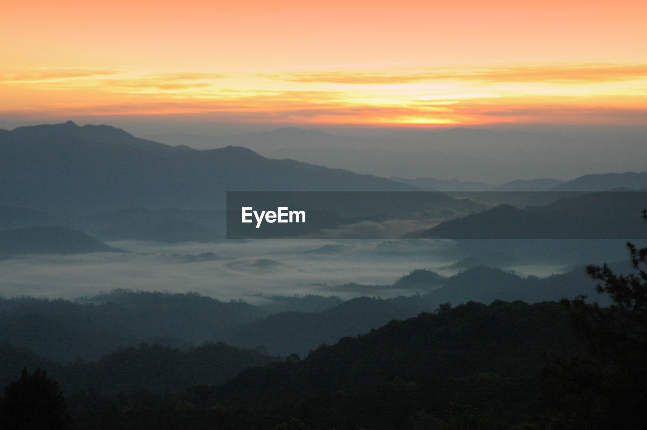 SILHOUETTE MOUNTAINS AGAINST SKY DURING SUNSET