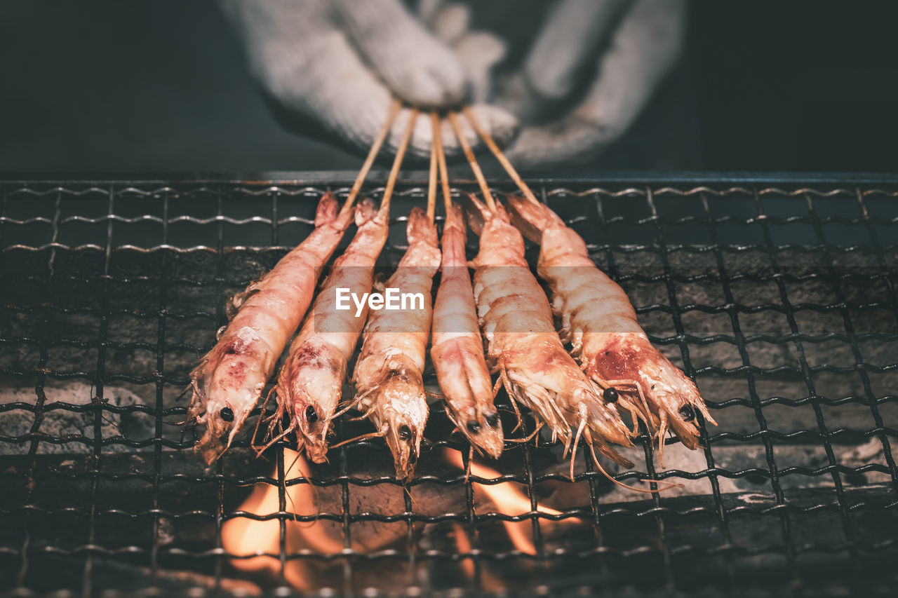 Close-up of meat on barbecue grill