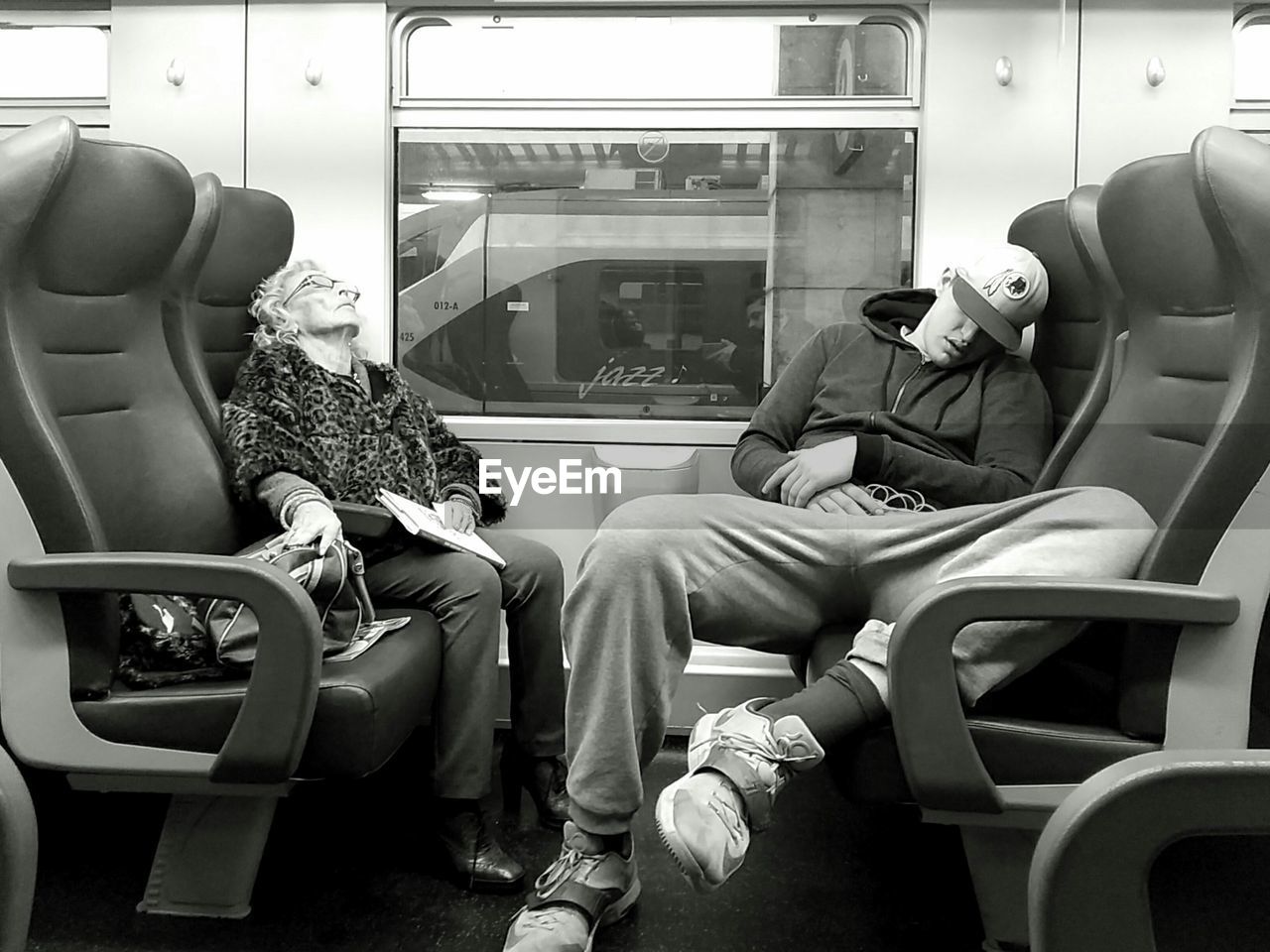 People sleeping in train