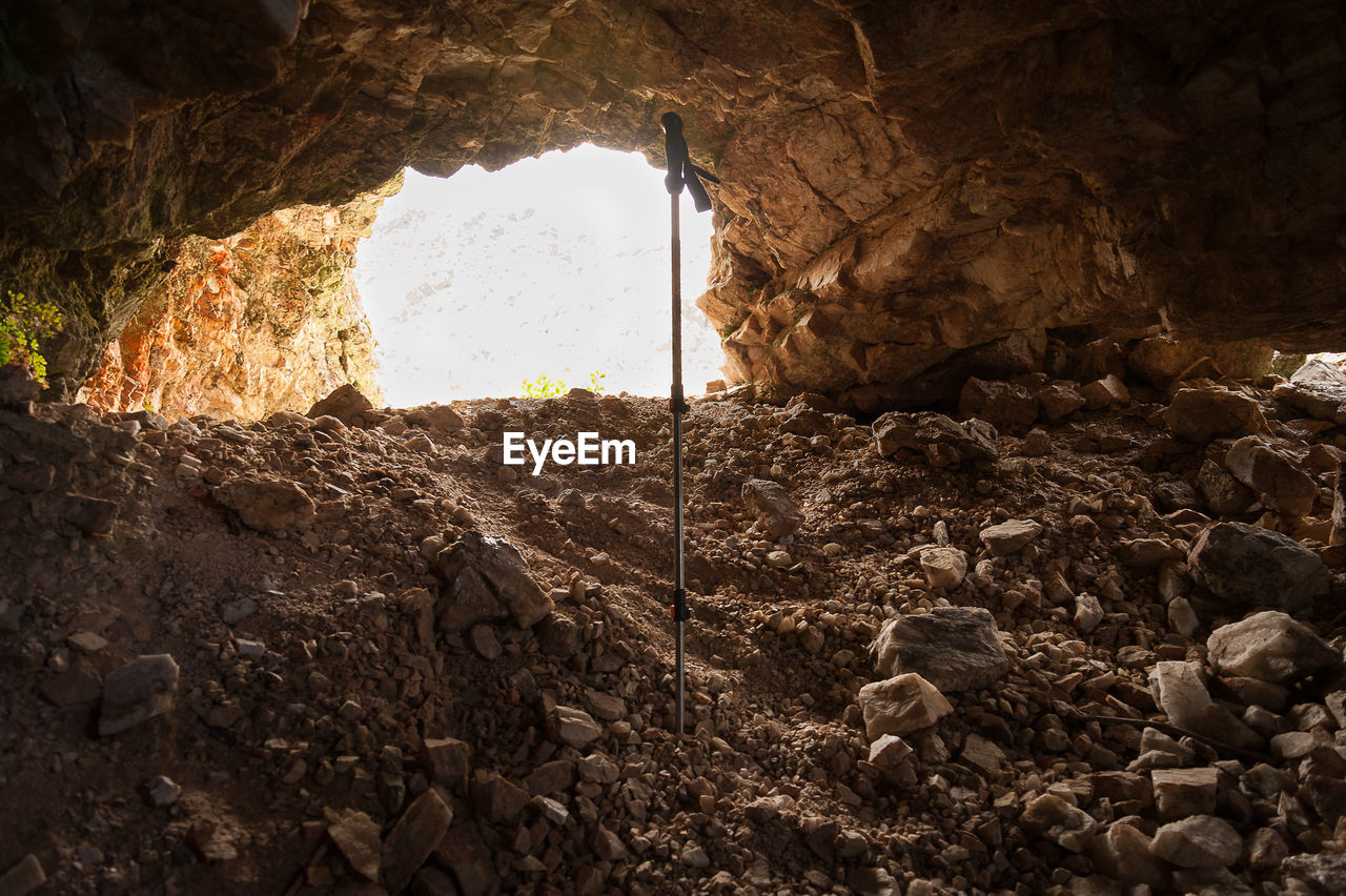 LOW ANGLE VIEW OF ROCK FORMATION ON LAND