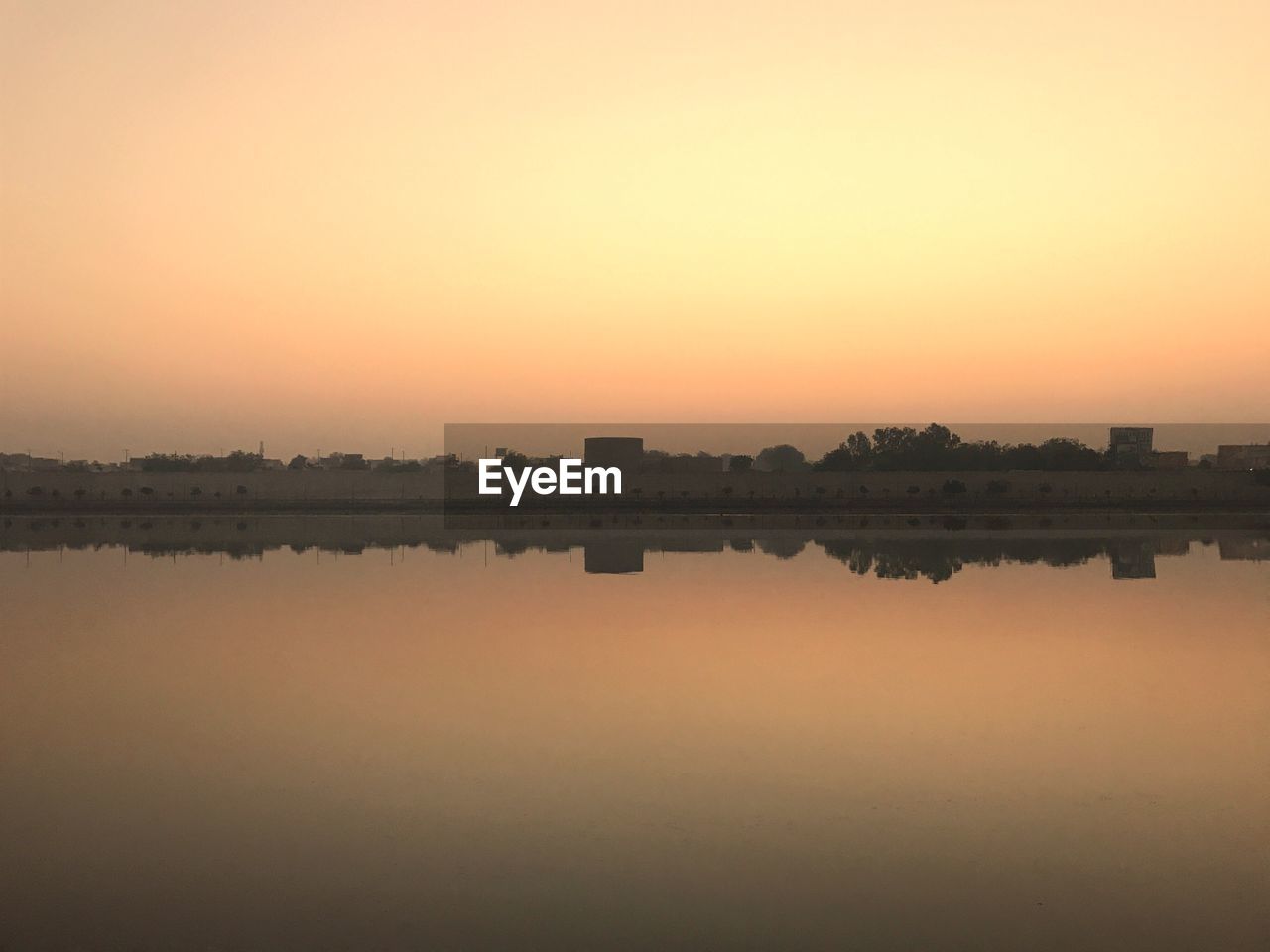 SCENIC VIEW OF LAKE DURING SUNSET