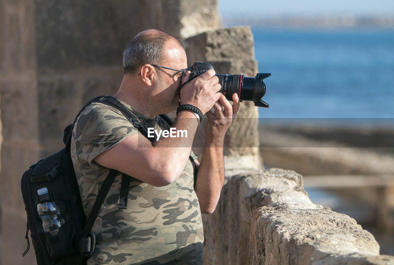 Midsection of man photographing