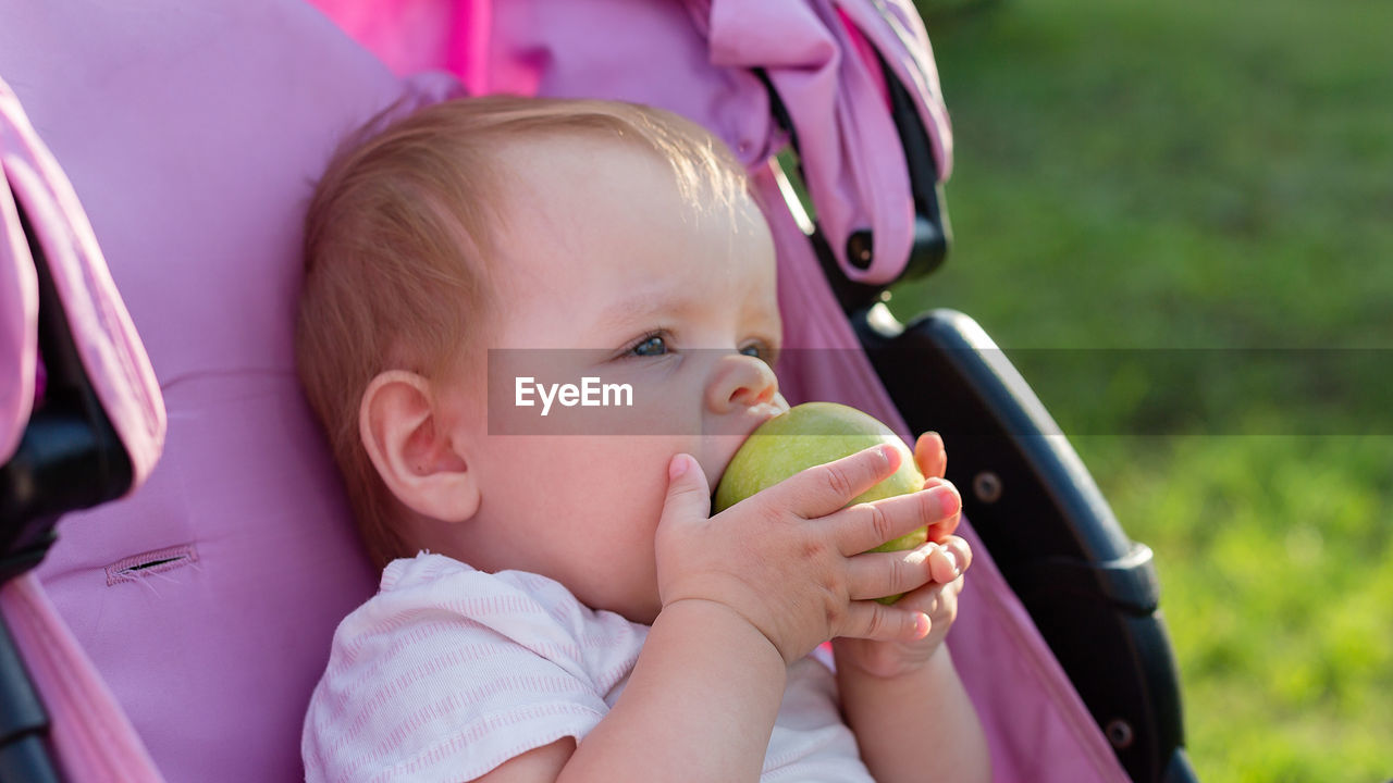 Cute girl eating apple
