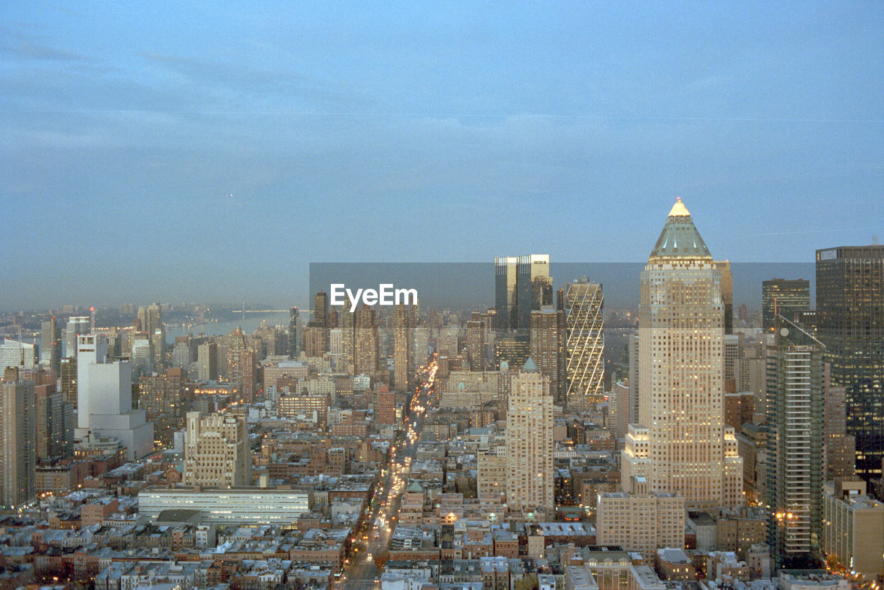 View of cityscape against blue sky