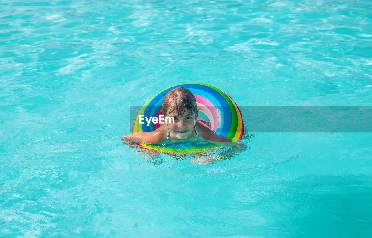 high angle view of man swimming in sea