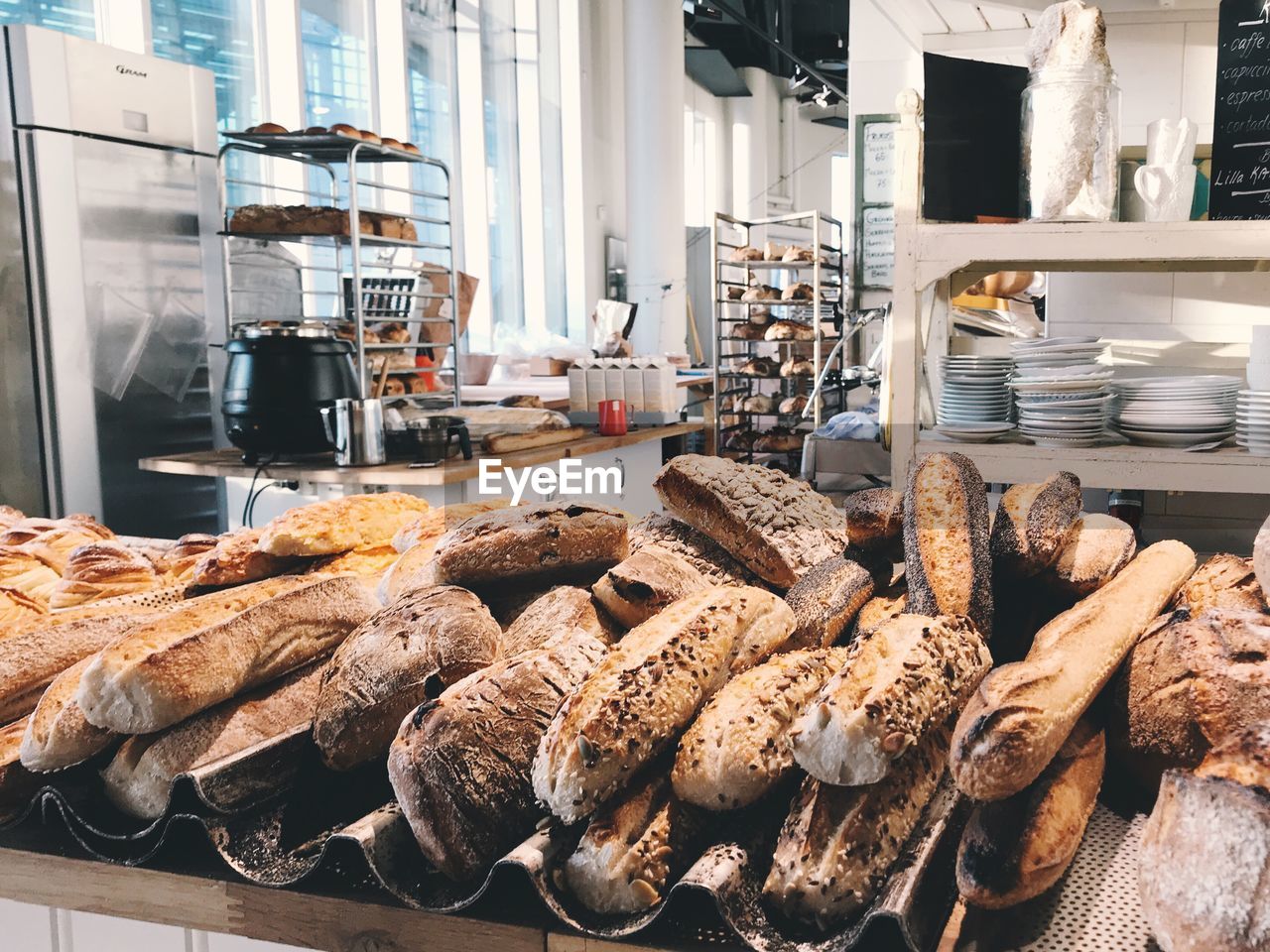 Loaves of bread on table in bakery