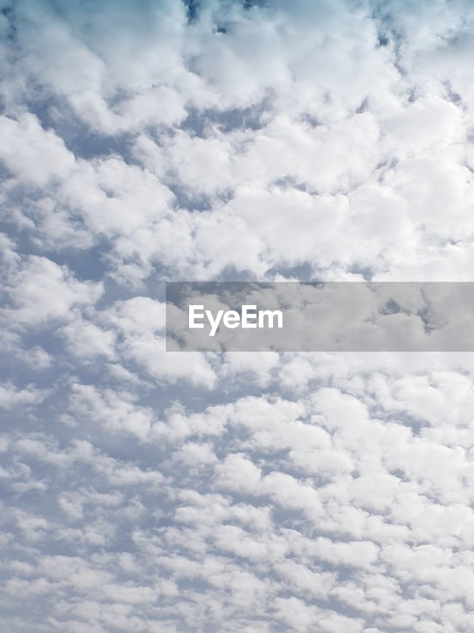 LOW ANGLE VIEW OF CLOUDS AGAINST BLUE SKY