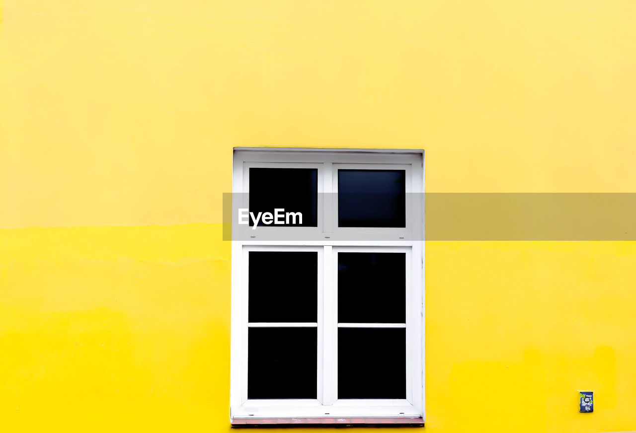 Window of yellow house