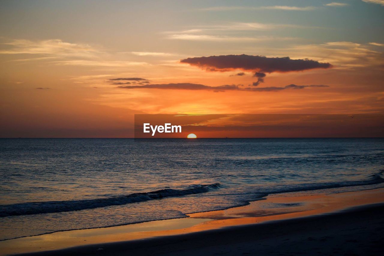 Scenic view of sea at sunset