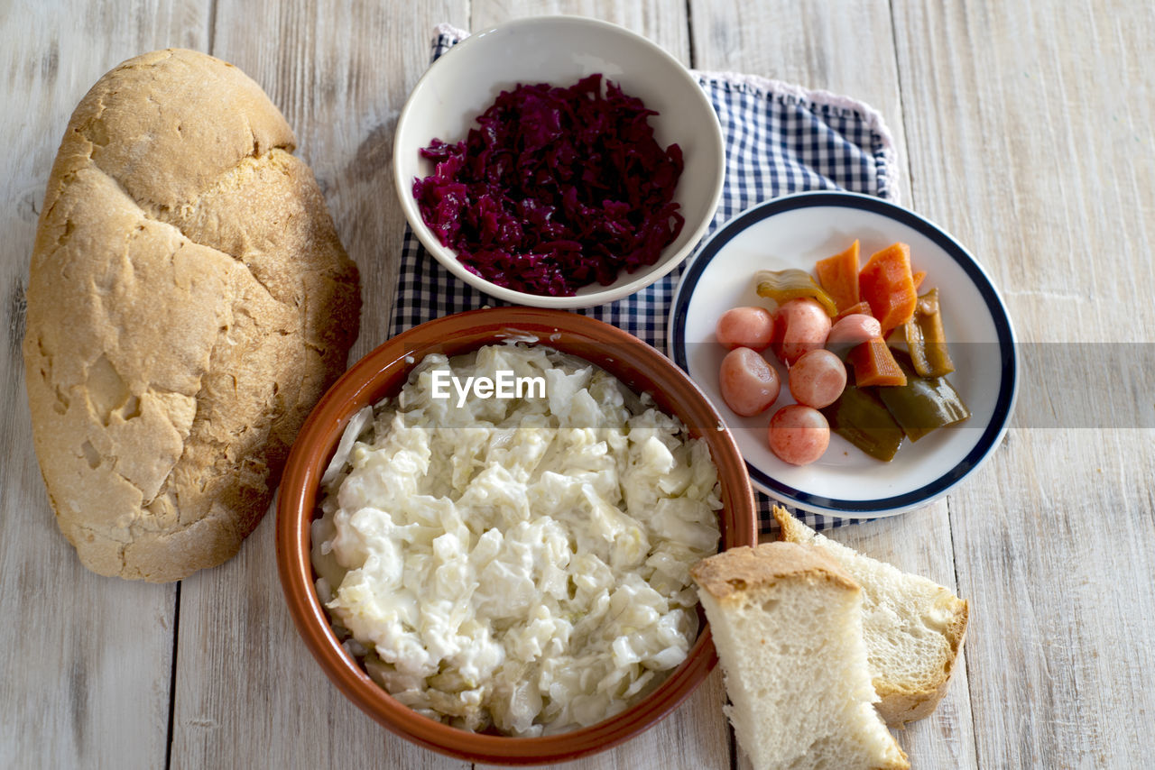 food and drink, food, healthy eating, bowl, wellbeing, freshness, variation, dish, wood, meal, high angle view, breakfast, dairy, indoors, no people, fruit, bread, table, studio shot, produce, vegetable, still life, cheese, directly above, cuisine