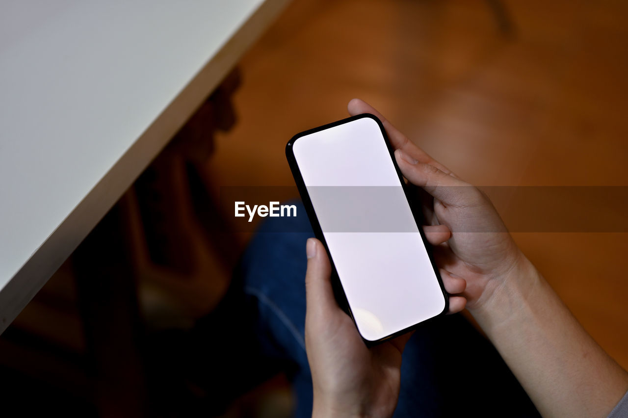 wireless technology, technology, communication, hand, smartphone, portable information device, mobile phone, one person, holding, adult, screen, internet, touch screen, indoors, portability, telephone, computer network, digital tablet, close-up, computer, lifestyles, copy space, business, touching, activity, young adult, mobile app