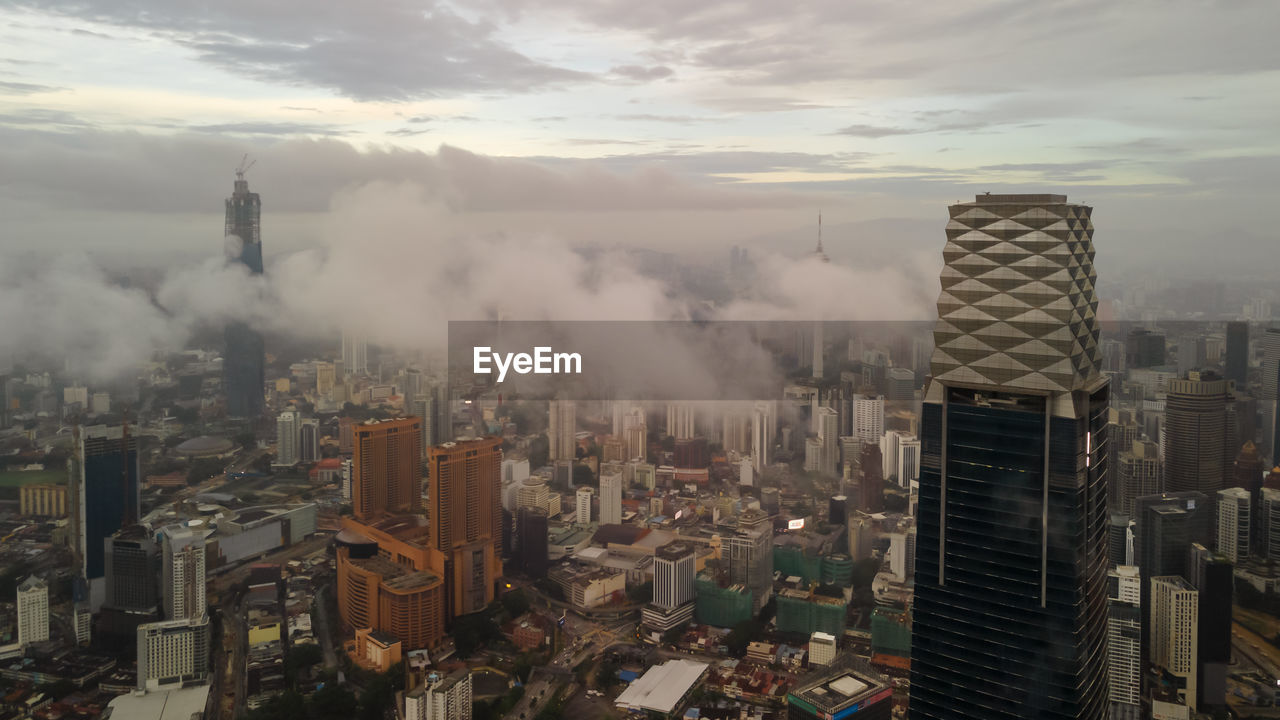 AERIAL VIEW OF BUILDINGS AGAINST SKY