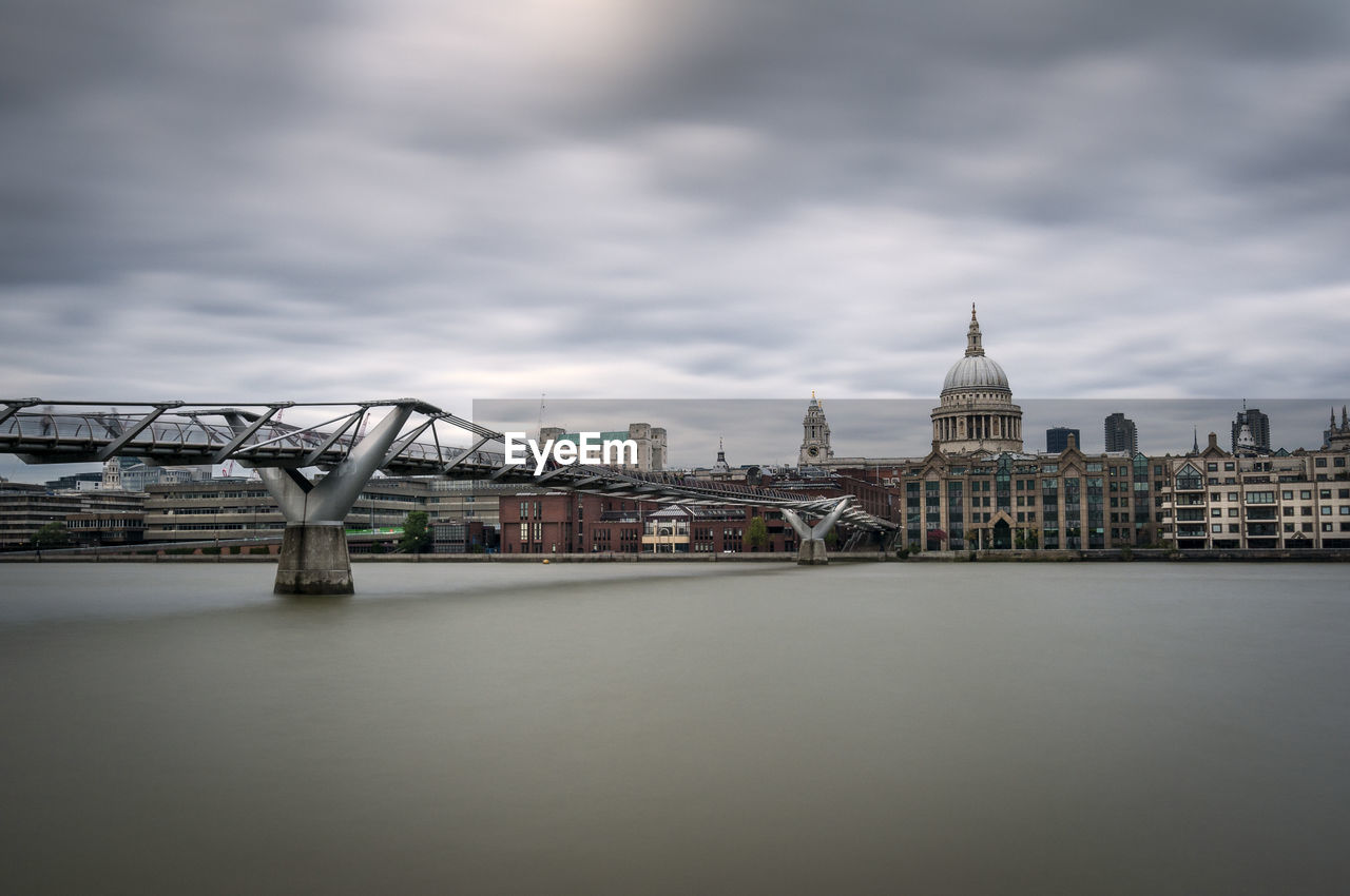 Millenium bridge over the river thames and st. paul's cathedral in london