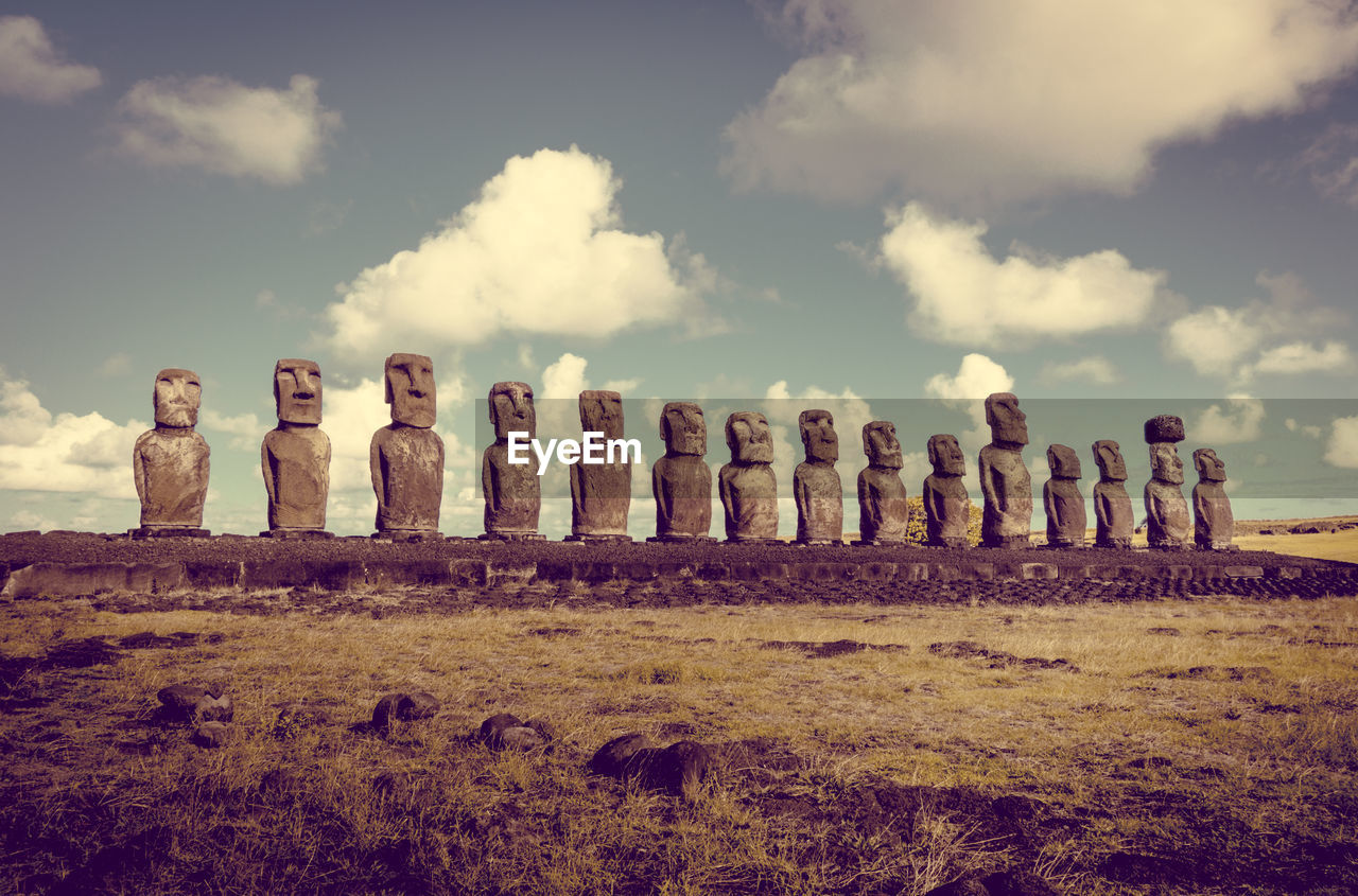 STACK OF STONES ON FIELD