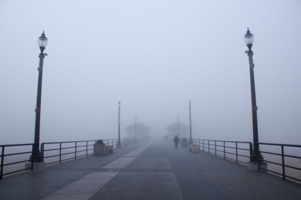 Bridge against sky during foggy weather