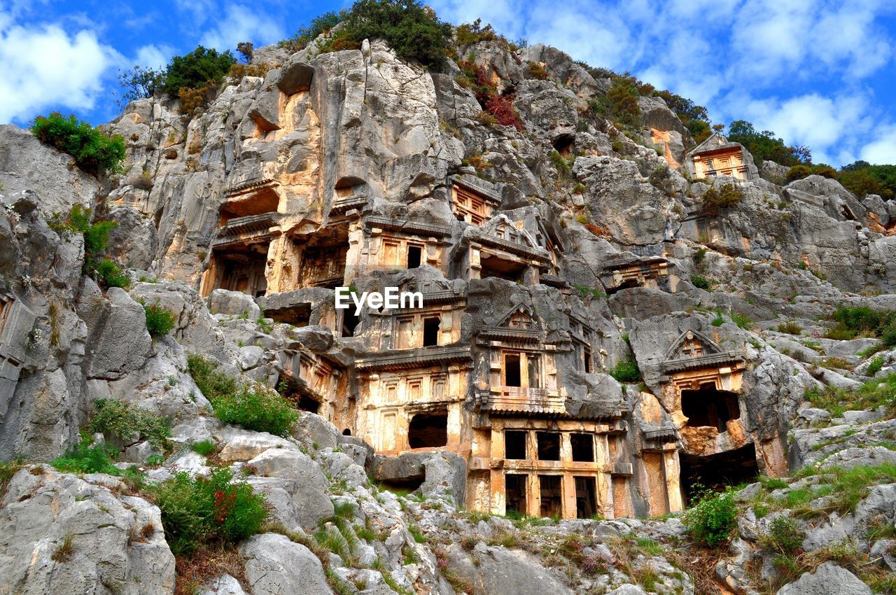 Low angle view of lycian tombs at the ruins of myra