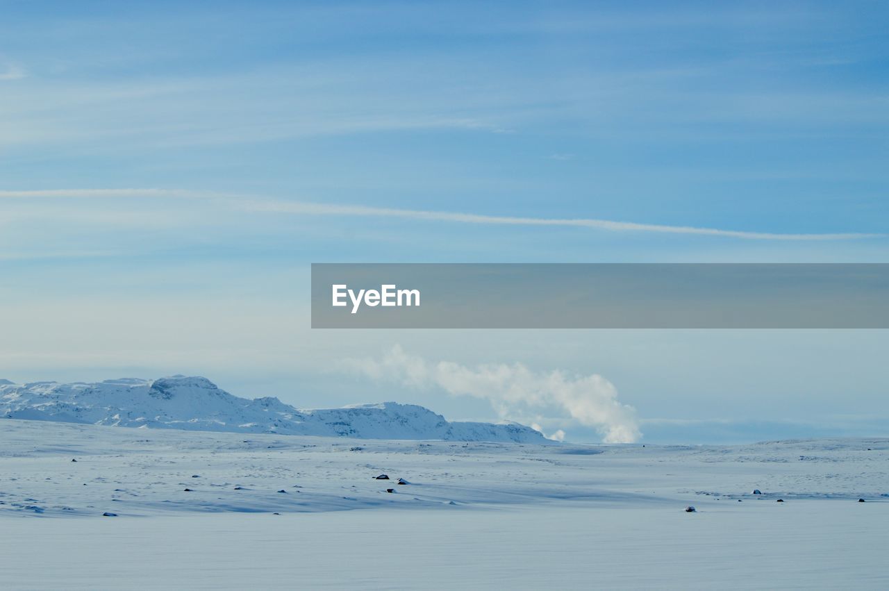 Scenic view of sea against sky during winter