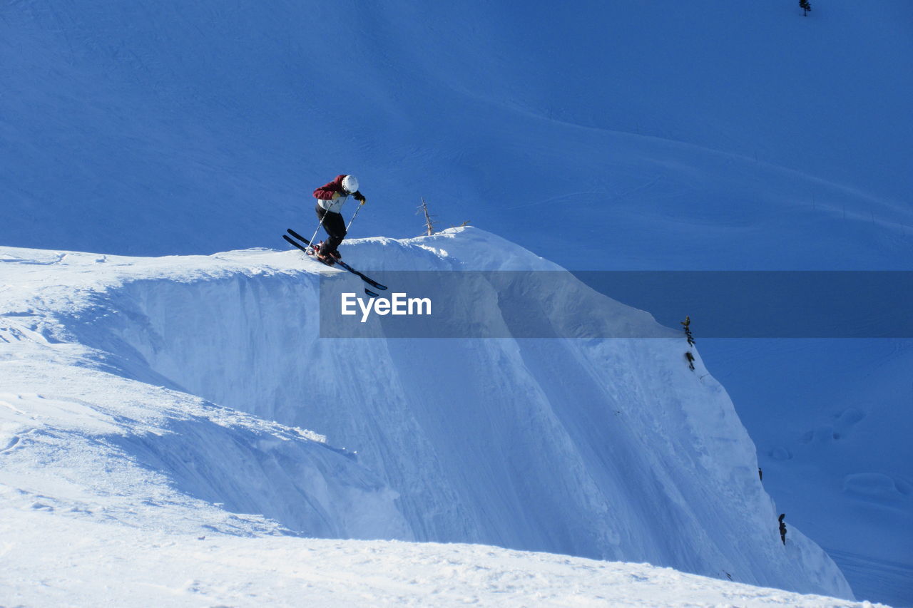 Low angle view of man skiing on  mountain 