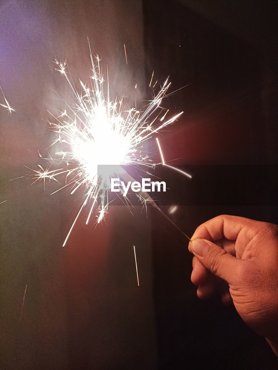 hand, fireworks, sparkler, motion, event, arts culture and entertainment, holding, sparks, one person, celebration, blurred motion, burning, glowing, illuminated, exploding, long exposure, finger, firework - man made object, firework display, light, adult, men, fire, flower, close-up