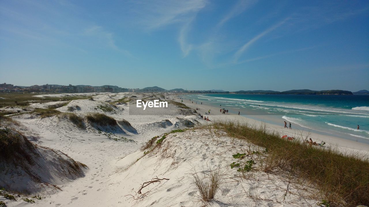 Scenic view of beach against blue sky