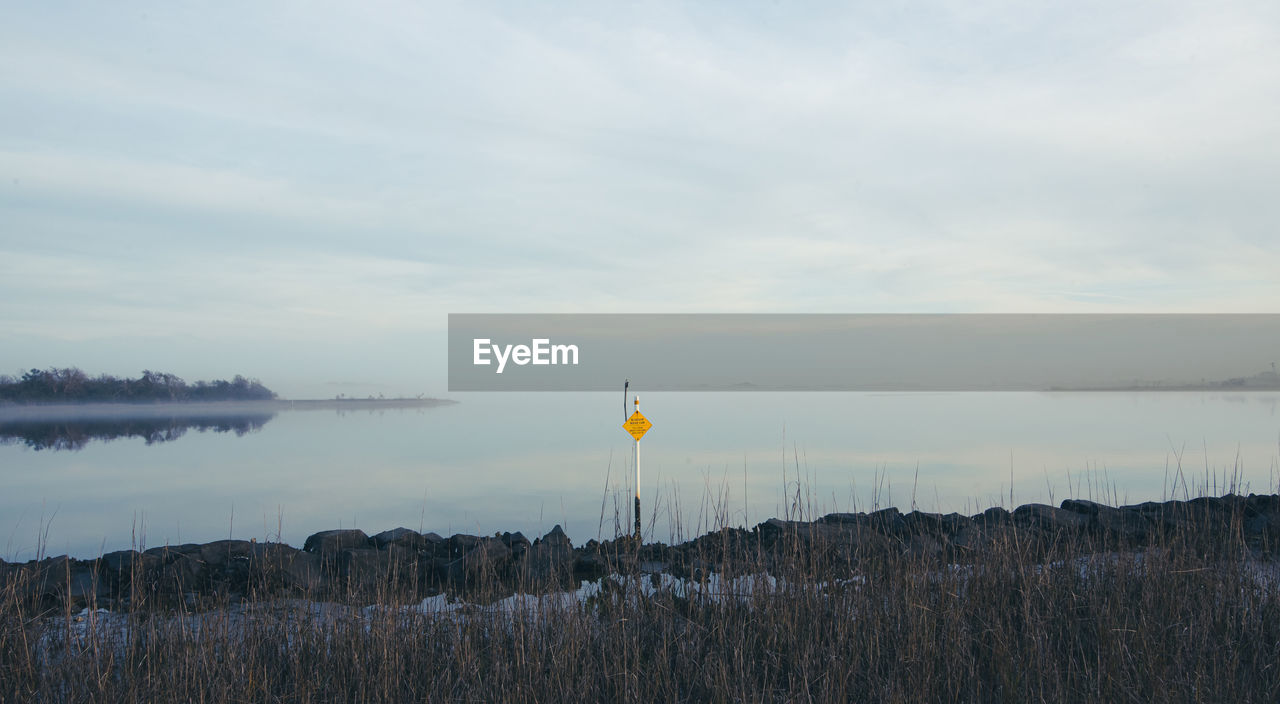 Scenic view of land against sky during sunset