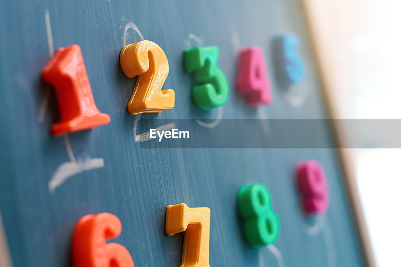 multi colored, childhood, indoors, education, close-up, learning, number, text, blackboard, alphabet, toy, selective focus, letter, school