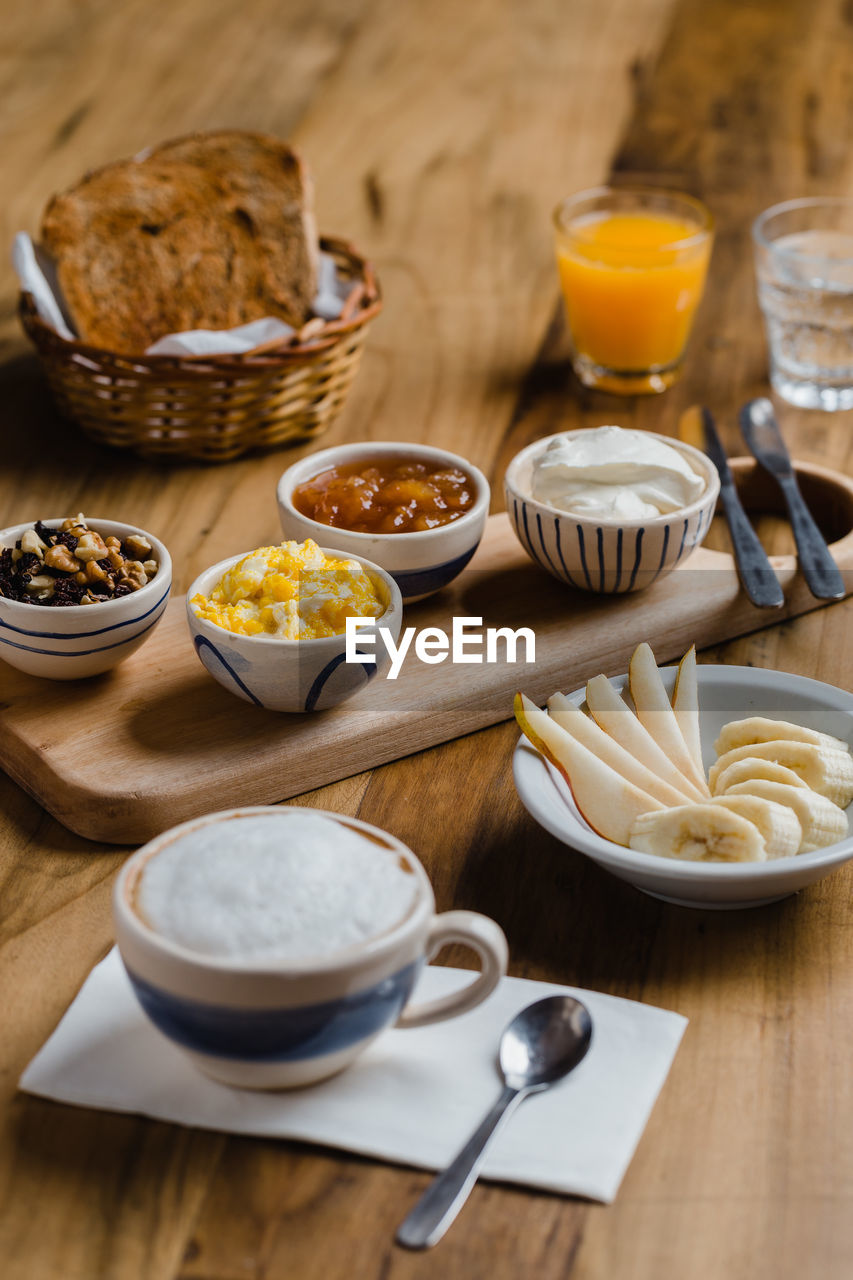 HIGH ANGLE VIEW OF BREAKFAST AND TABLE