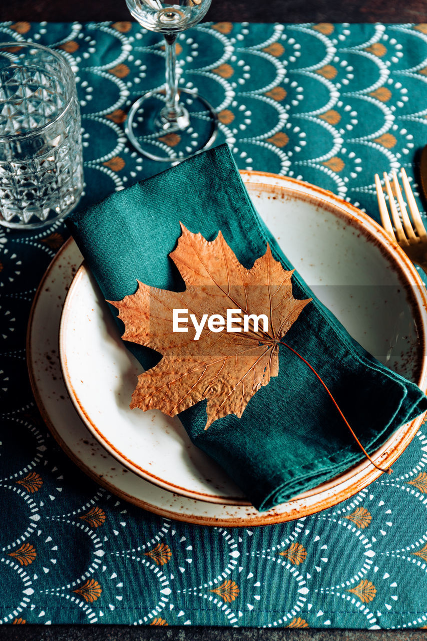 High angle view of leaf in plate on table