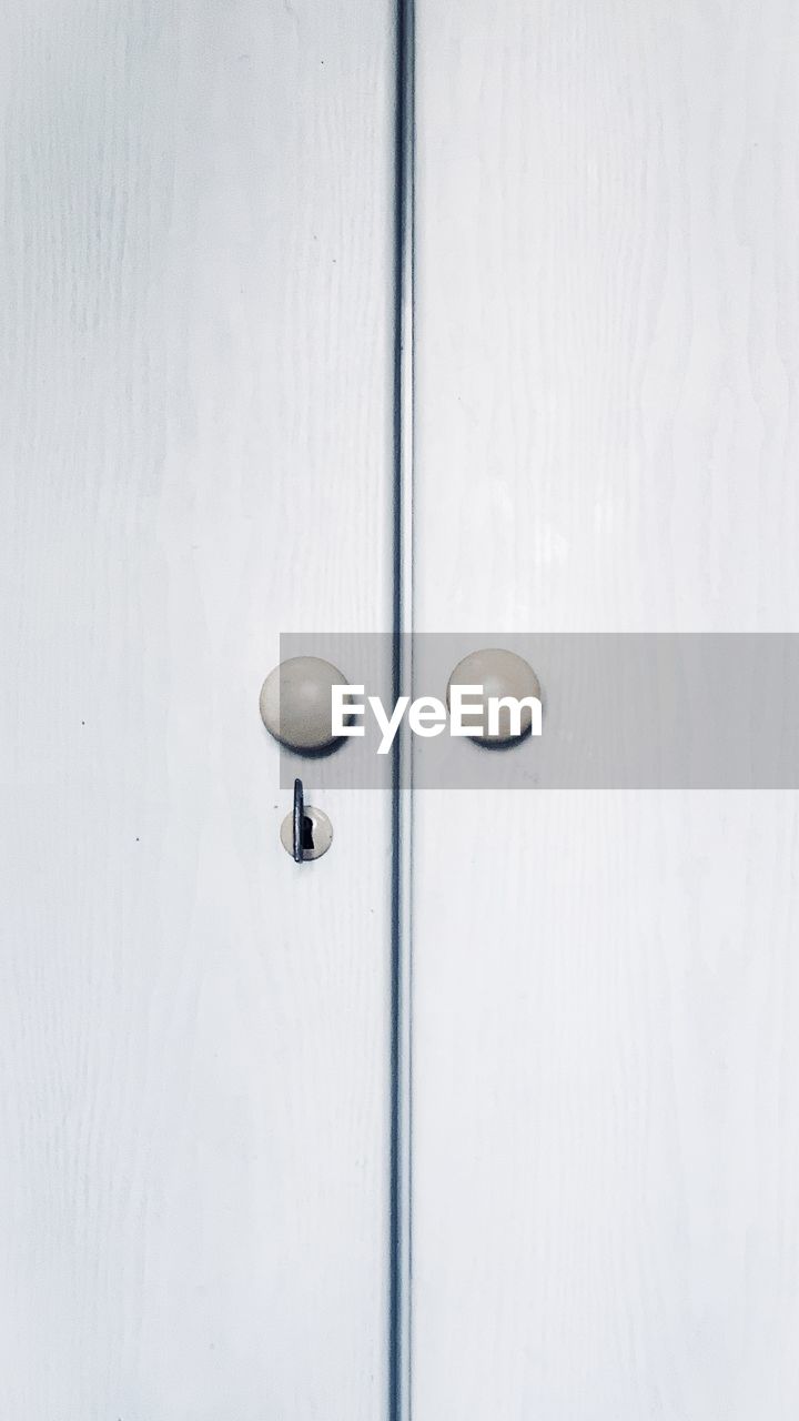 door, entrance, security, no people, protection, doorknob, metal, closed, knob, white, handle, door handle, keyhole, lock, indoors, close-up, wood, full frame, backgrounds, furniture, wall - building feature, copy space, day