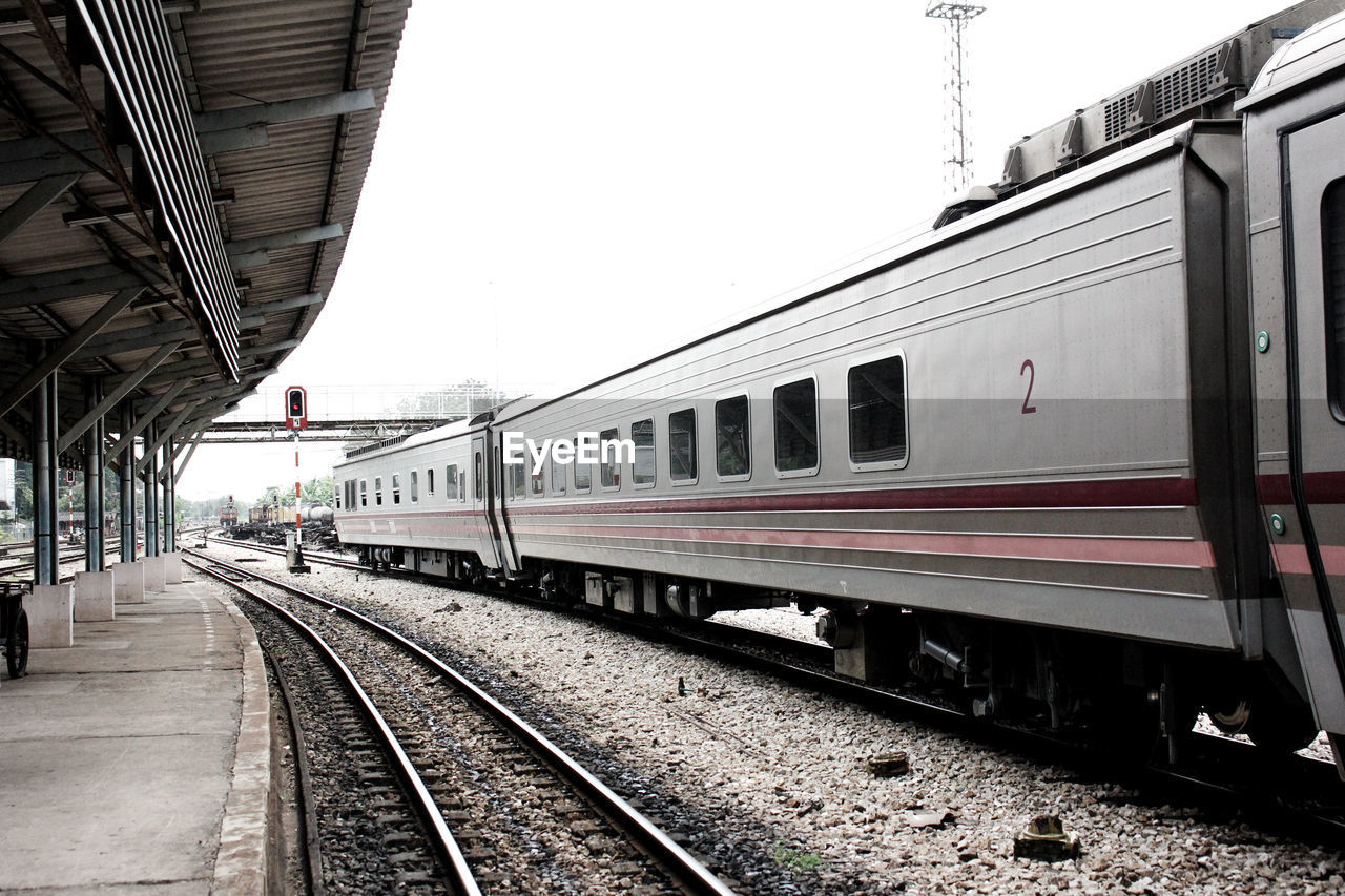 RAILROAD STATION PLATFORM AGAINST CLEAR SKY