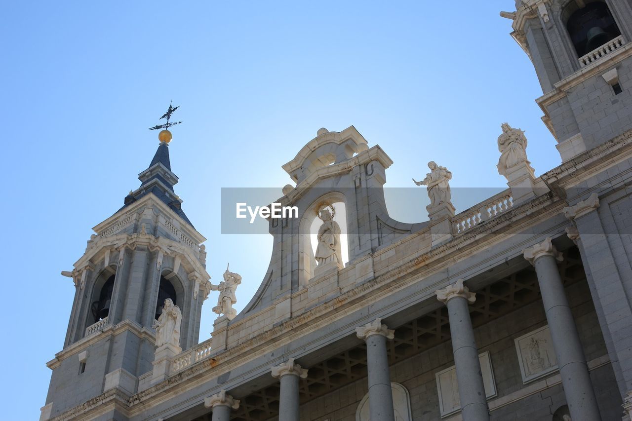 Low angle view of church in city against sky