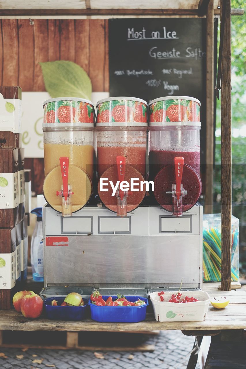 Fruit juice dispensers at market