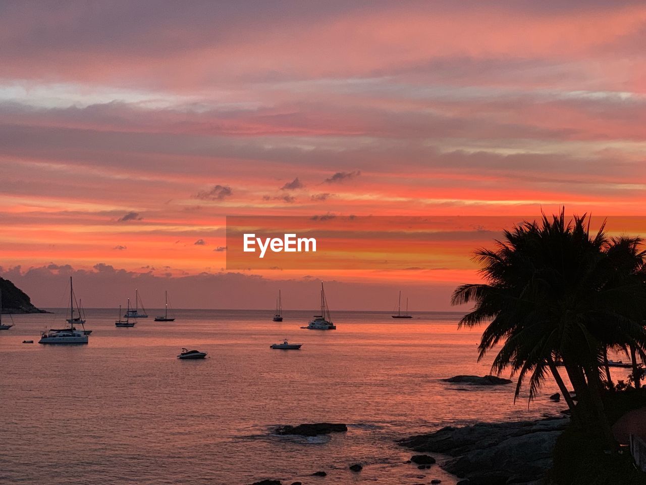 Scenic view of sea against orange sky