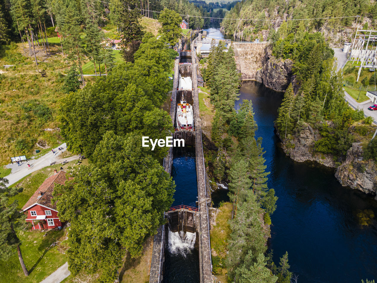 Aerial view of tourboat passing through vrangfoss locks