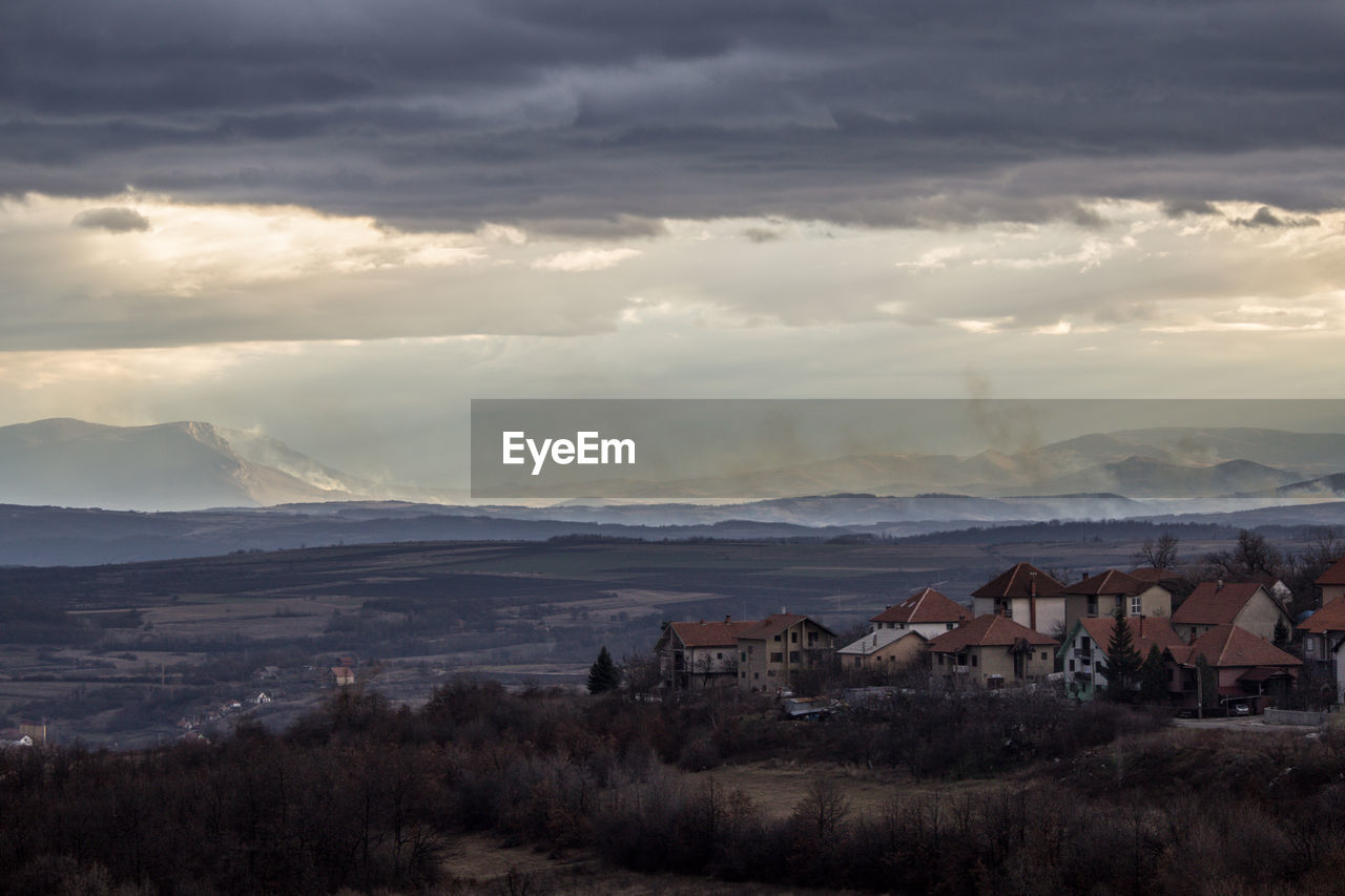 Scenic view of townscape against sky