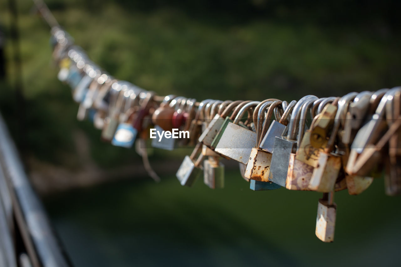 Close-up of padlocks on railing