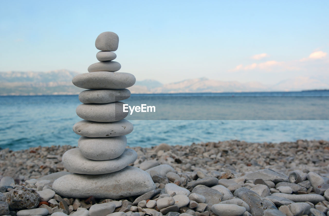 STACK OF PEBBLES ON SHORE