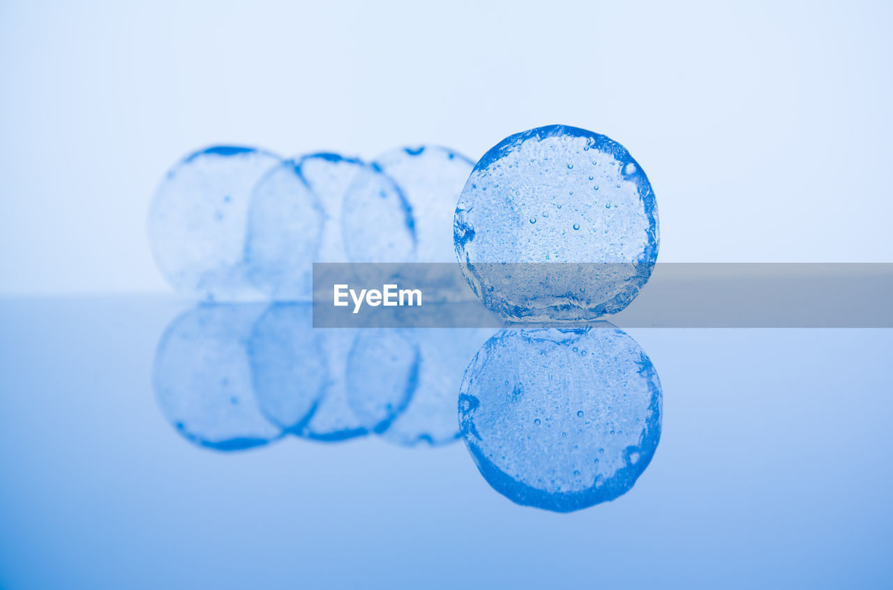 Close-up of bubbles on white background