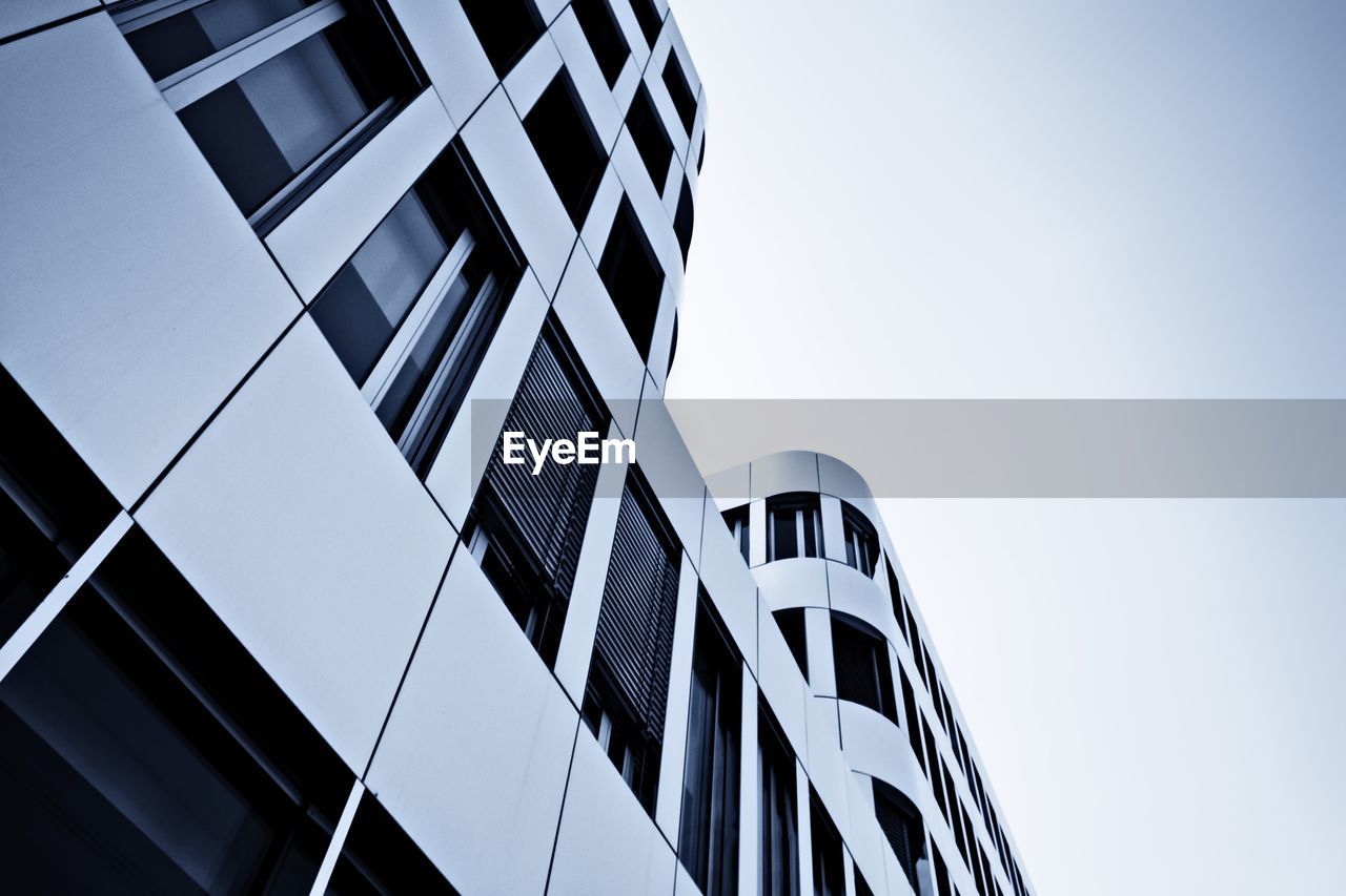 Low angle view of modern building against clear sky