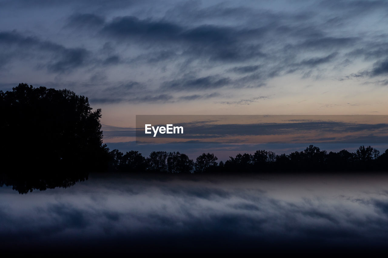 SCENIC VIEW OF SILHOUETTE TREES AGAINST SKY AT SUNSET