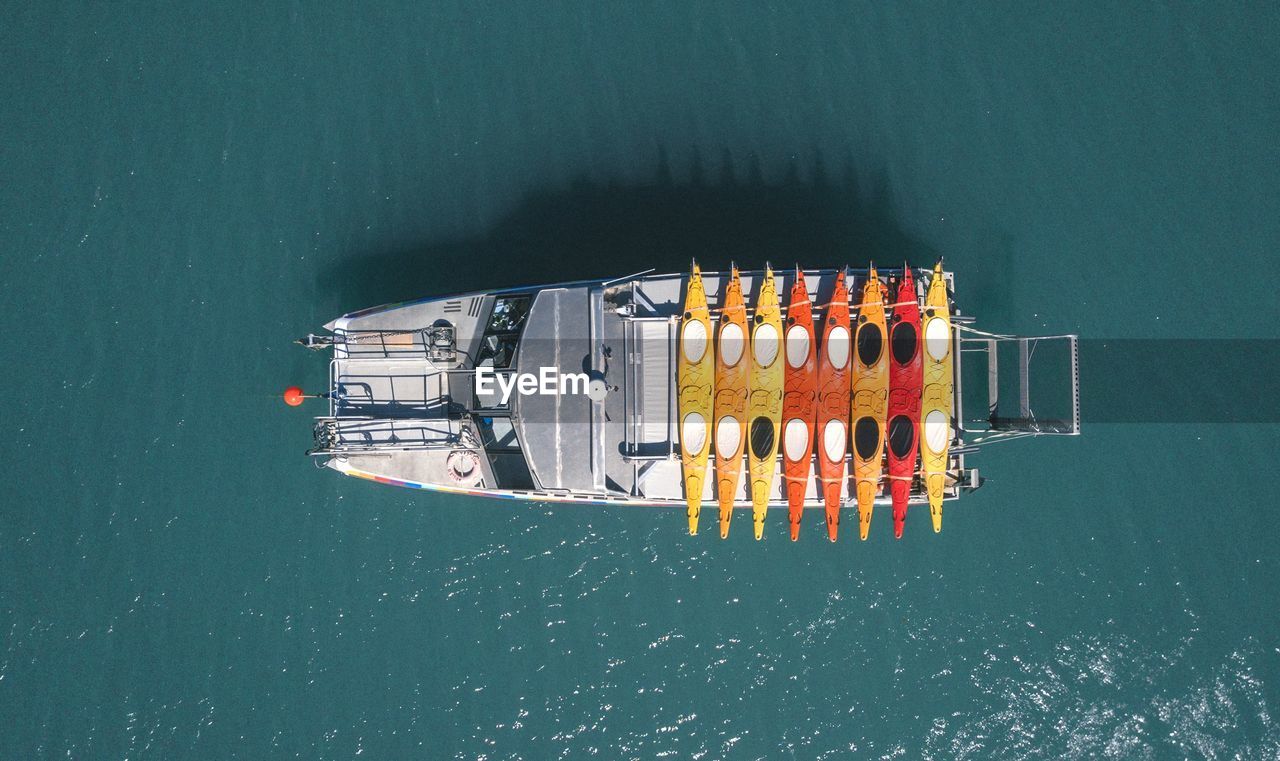 High angle view of ship moving on sea during sunny day