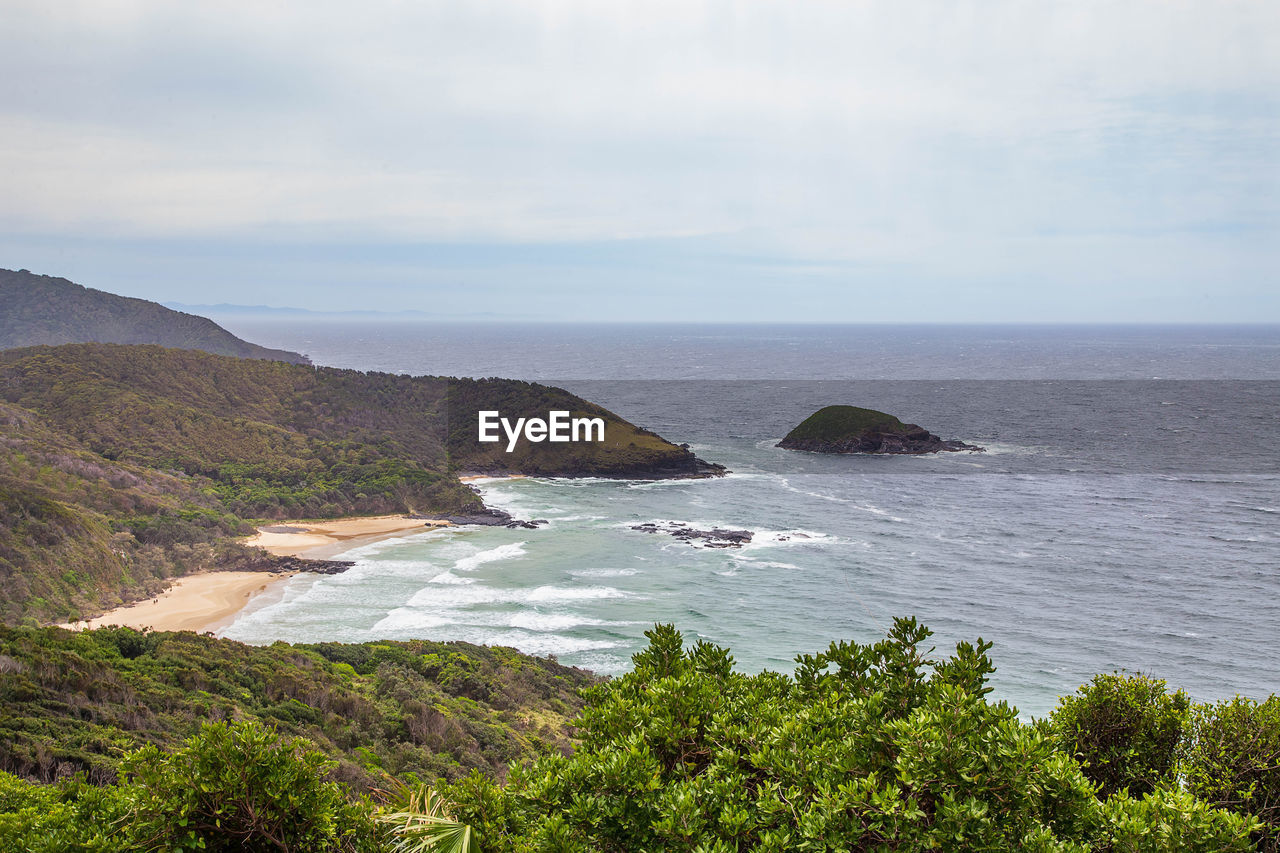 water, sea, scenics - nature, beauty in nature, coast, land, sky, shore, body of water, nature, ocean, beach, plant, tranquility, tranquil scene, no people, bay, cloud, cliff, horizon over water, day, non-urban scene, horizon, environment, outdoors, terrain, rock, tree, idyllic, travel destinations, cove, travel, mountain, landscape, coastline, tourism, high angle view