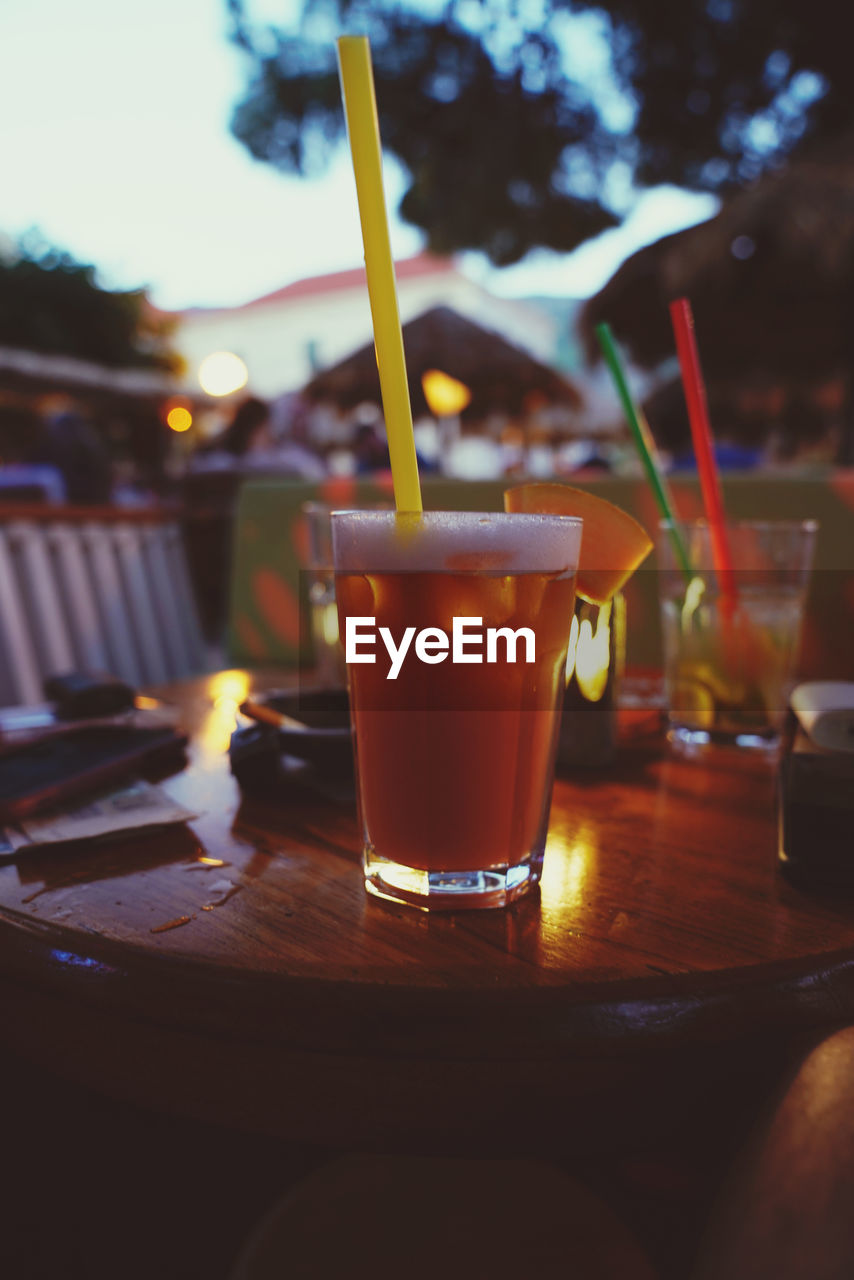 CLOSE-UP OF BEER ON TABLE