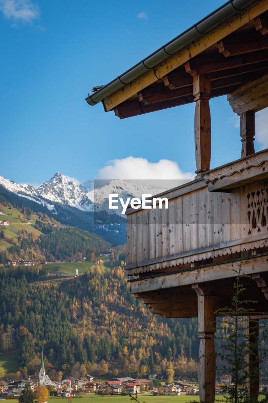Wooden balcony in front of mountains in the austrian alps