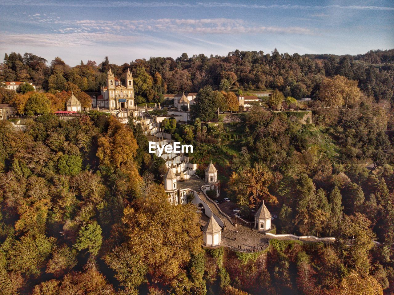 HIGH ANGLE VIEW OF BUILDINGS AND TREES IN TOWN