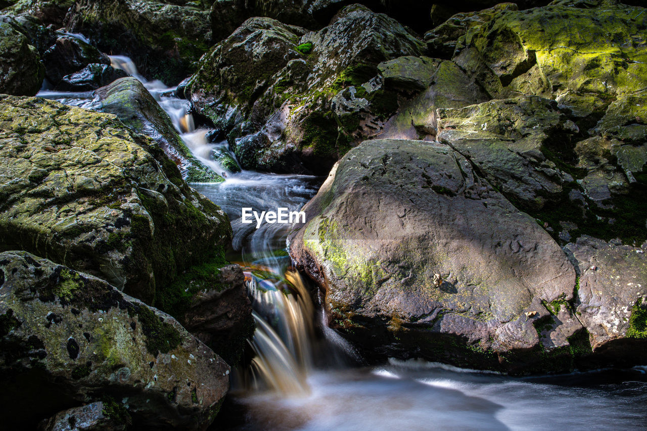 SCENIC VIEW OF WATERFALL