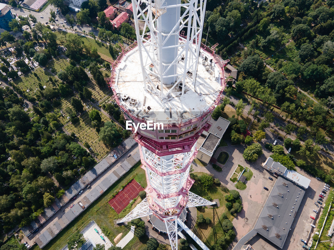 HIGH ANGLE VIEW OF FERRIS WHEEL AGAINST BUILDING