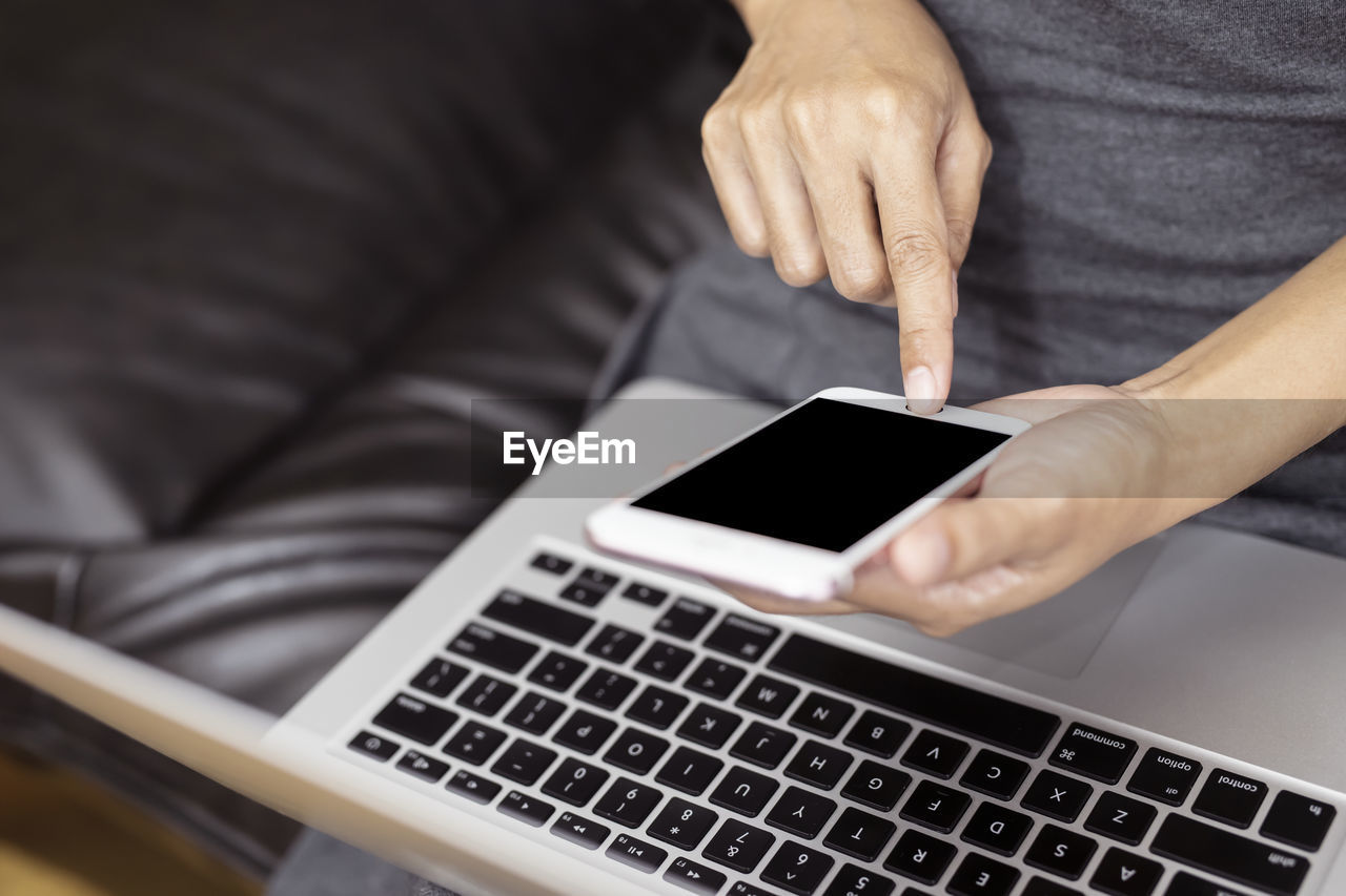 MAN USING MOBILE PHONE