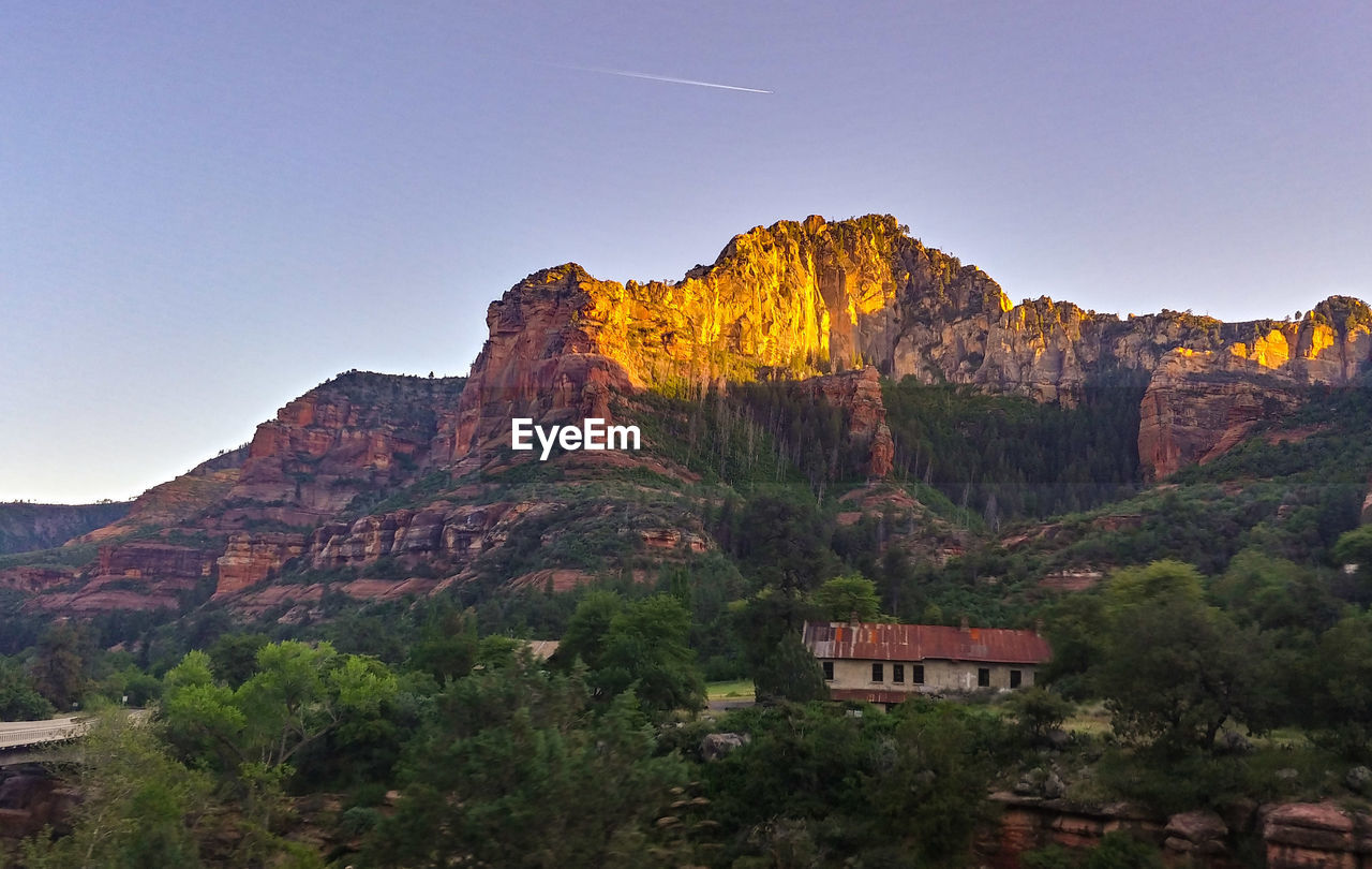 SCENIC VIEW OF ROCK FORMATION AGAINST SKY