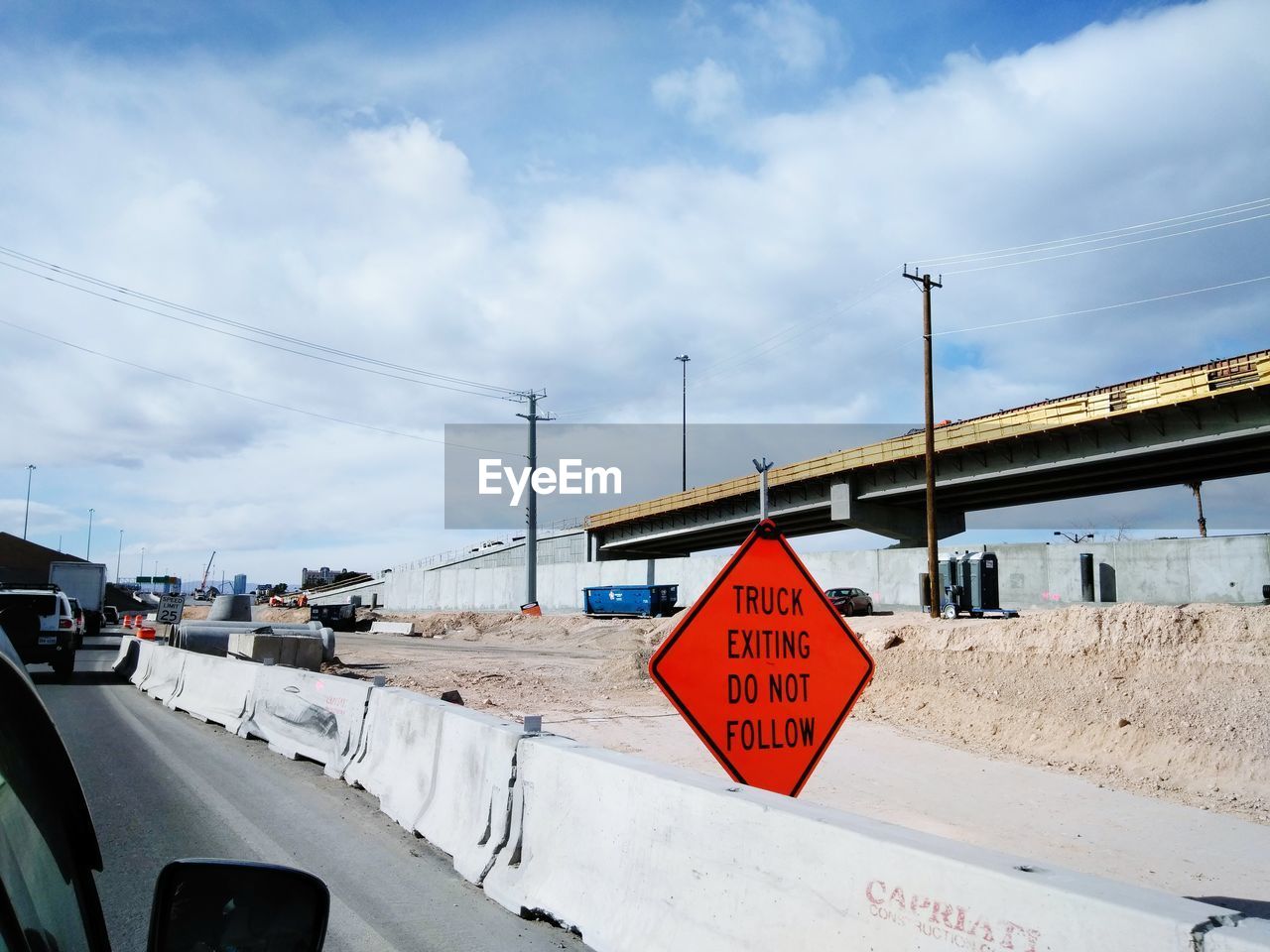 ROAD SIGN AGAINST SKY